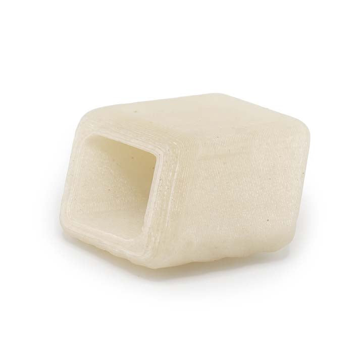 Onderkant van de crème witte Oyster Rays Cube met matte, gespikkelde structuur