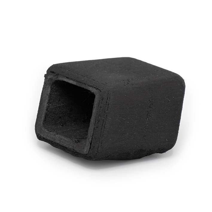 Onderkant van de zwarte Ebony Cube, met matte 3D-geprinte houtstructuur
