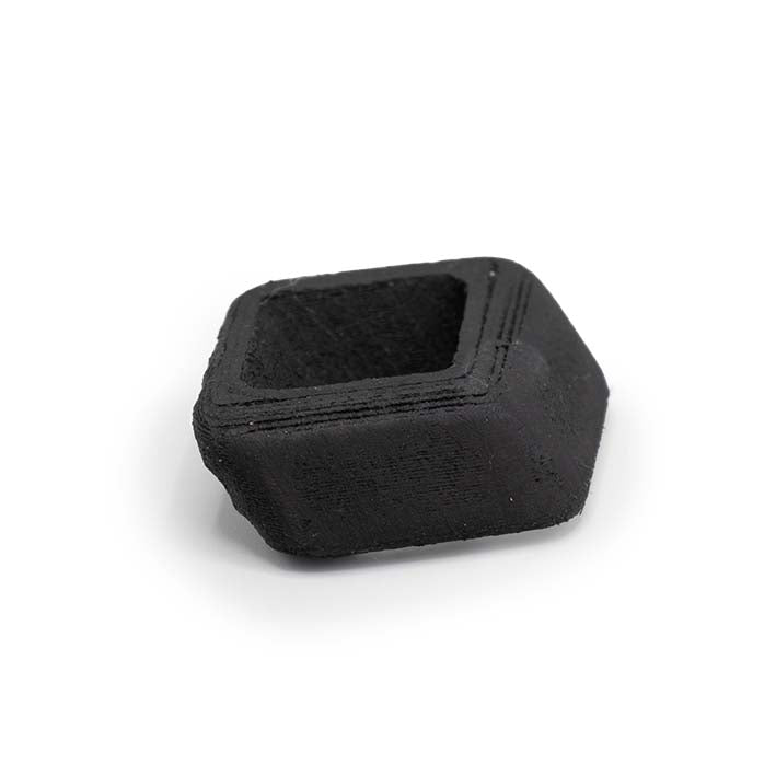 Onderkant van de zwarte Ebony Rays Spacer met matte houtstructuur
