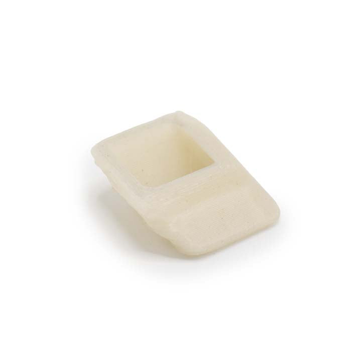 Onderkant van de crème witte Oyster Tree Bark Spacer met gespikkelde structuur